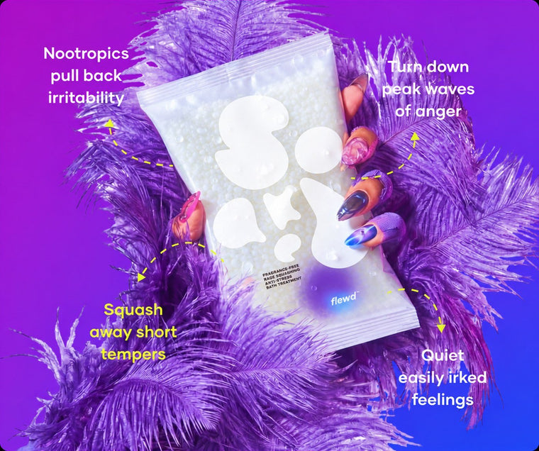 Flewd fragrance-free Rage Squashing bath soak clear pouch held in purple feathers, for irritable days