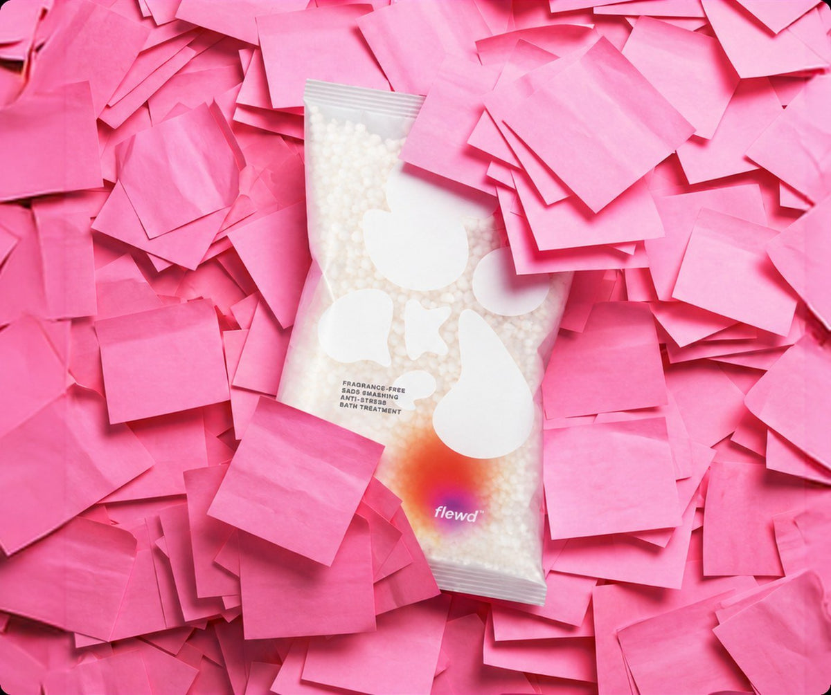 Flewd fragrance-free Sads Smashing stresscare bath soak clear pouch on a pile of pink sticky notes