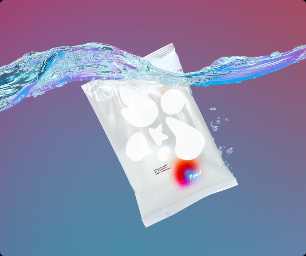Flewd Ache Erasing magnesium bath soak pouch splashing into water on a purple and blue background