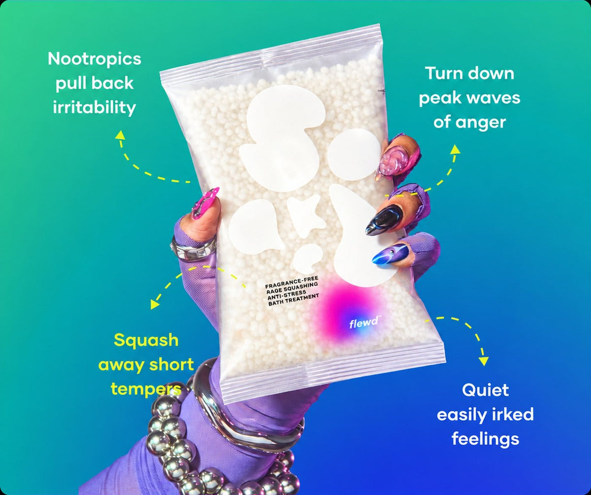 Fragrance-free Rage Squashing pouch held by a purple glove, part of the Flewd Nootropic Trio
