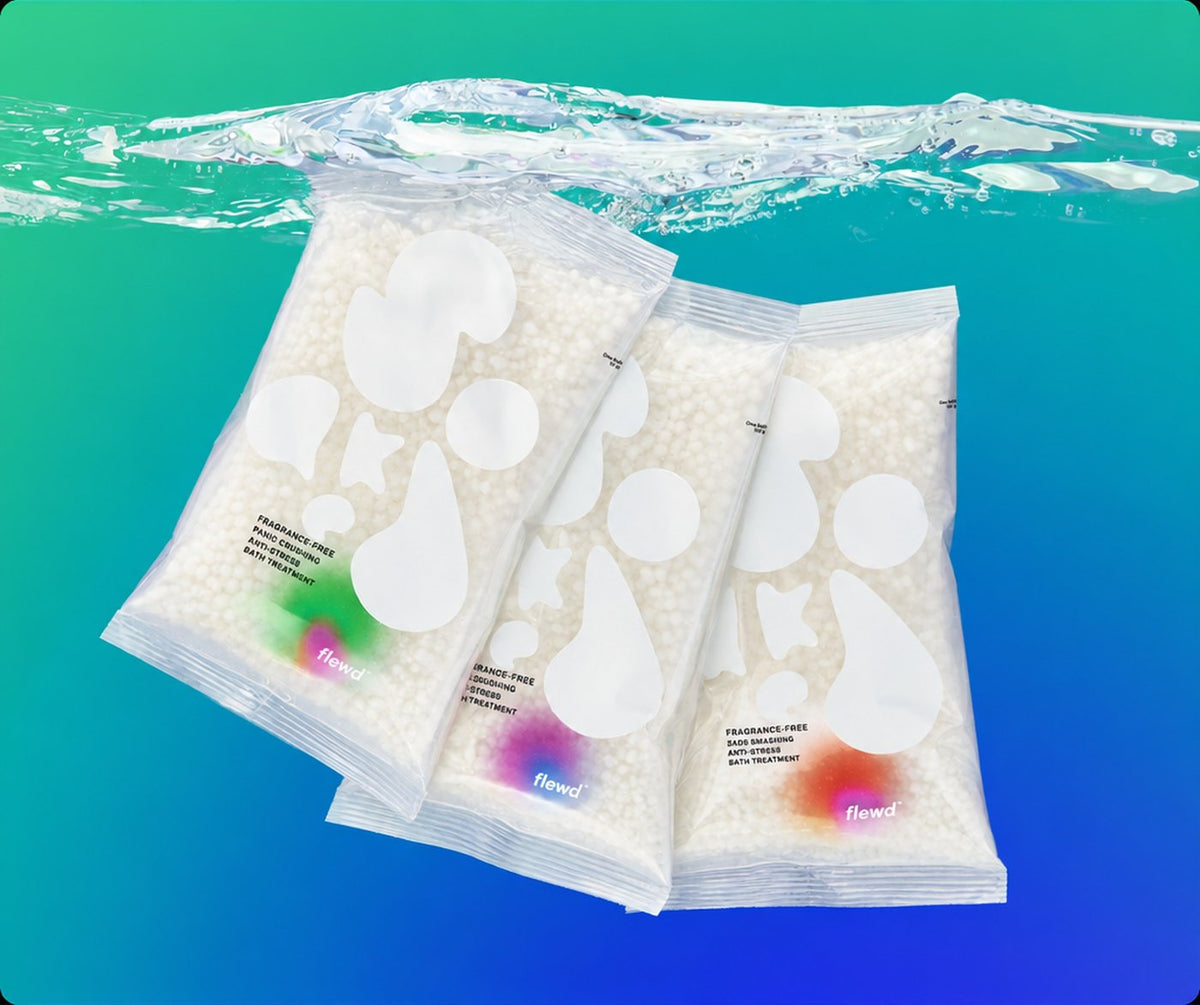 Three fragrance-free Nootropic Trio bath soak pouches underwater