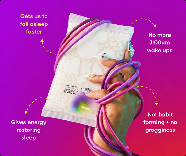 Fragrance-free Insomnia Ending pouch in a hand wrapped in purple cables, part of the Flewd Whole Mood Bundle