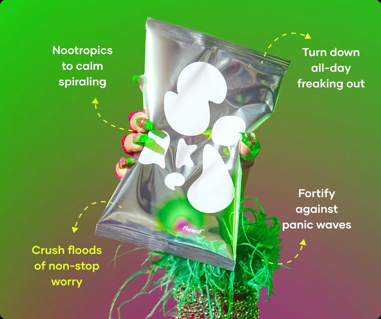 Flewd Panic Crushing bath soak pouch held in a green-painted hand, for overwhelmed moments