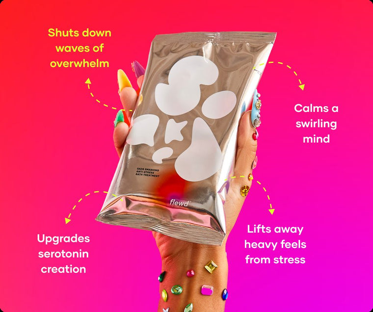 Flewd Sads Smashing bath soak pouch held in a hand with jeweled nails, for overwhelmed days