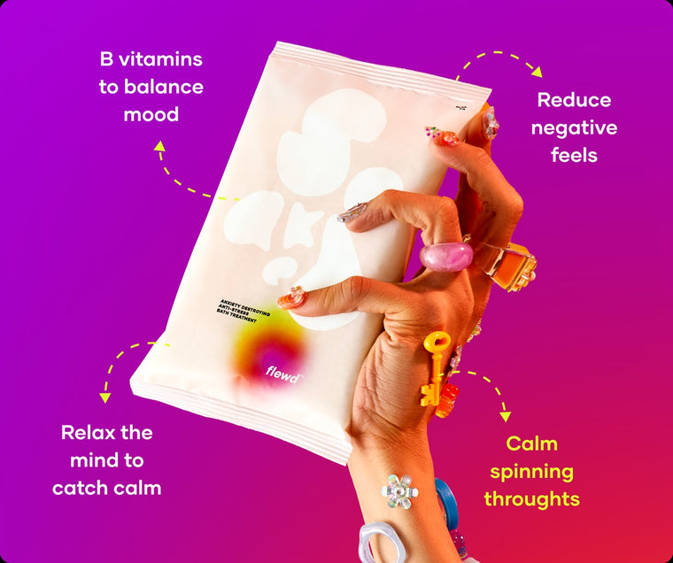 Anxiety Destroying pouch in a hand with colorful rings, part of the Flewd Whole Mood Bundle